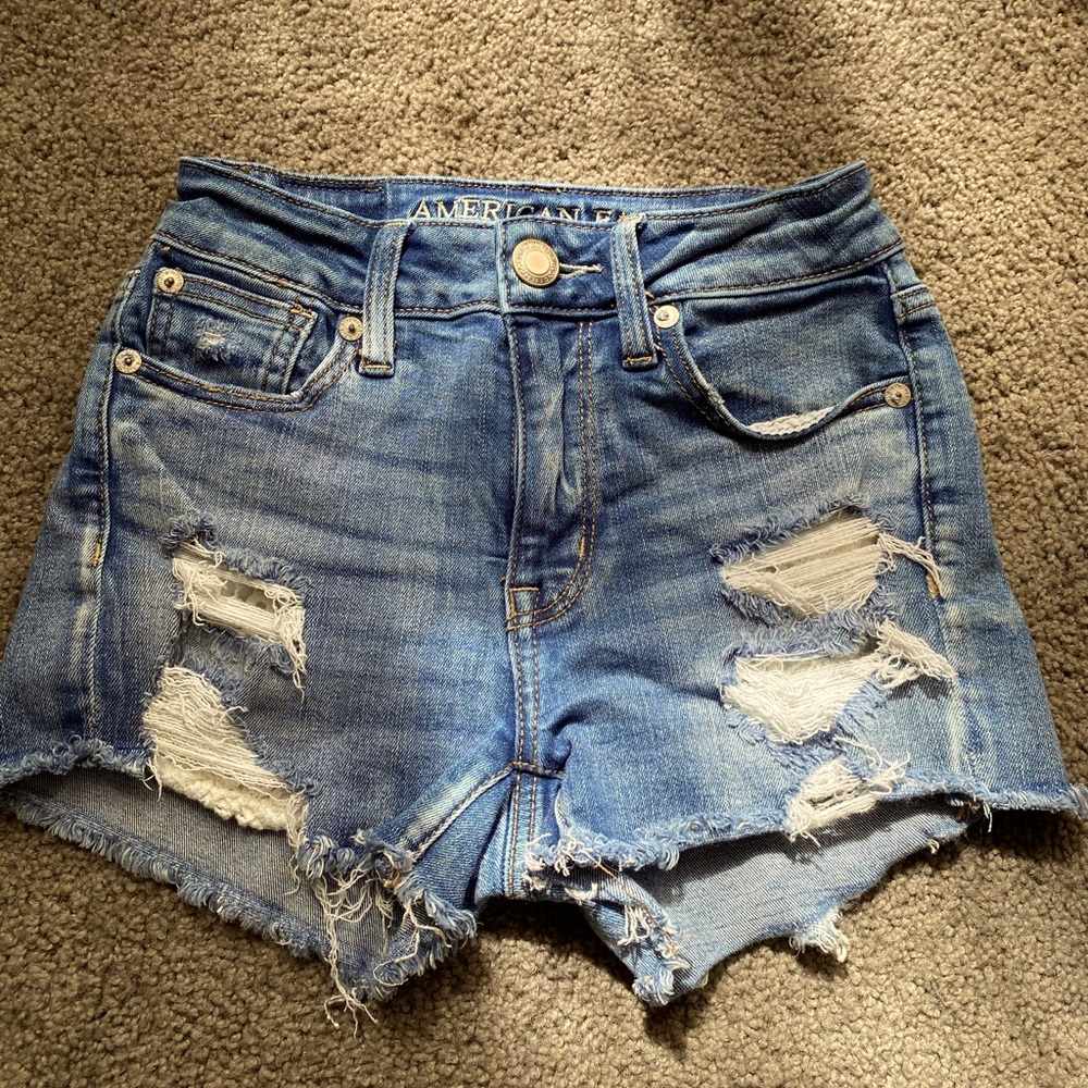 Lighter blue, Hi-rise American eagle shorts.